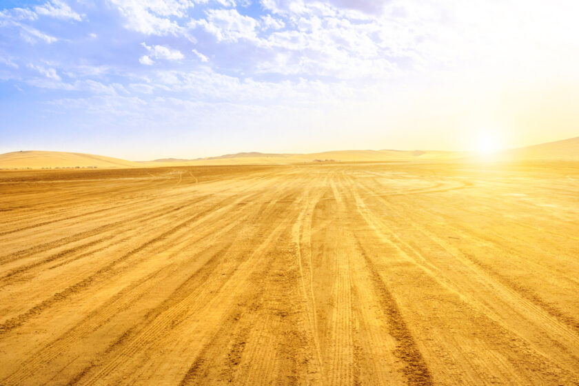 Desert landscape sand dunes at sunset sky near Qatar and Saudi Arabia. Khor Al Udeid, Persian Gulf, Middle East. Discovery and adventure travel concept.