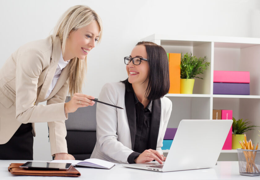 two woman working together