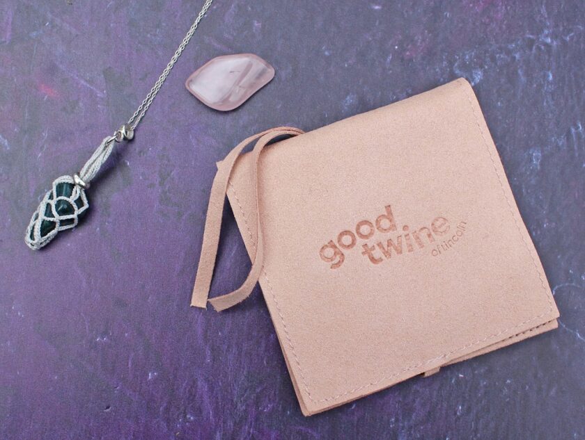 Good Twine of Lincoln Interchangeable crystal pouch necklace prize