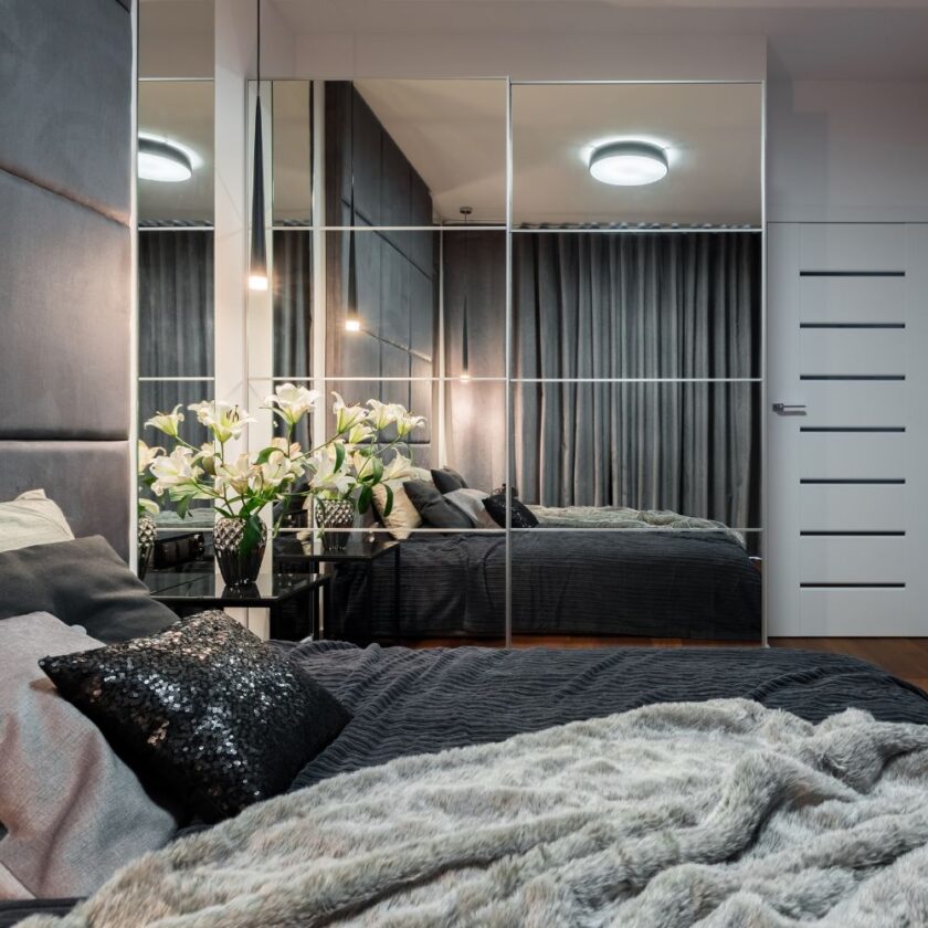 bedroom with mirrored wardrobe