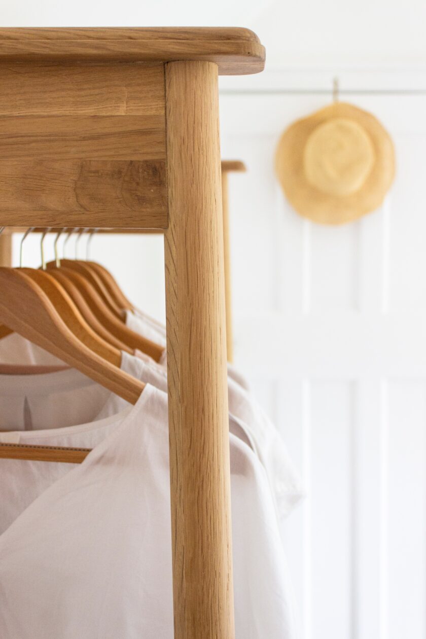 bedroom furniture clothes hanging on a rail