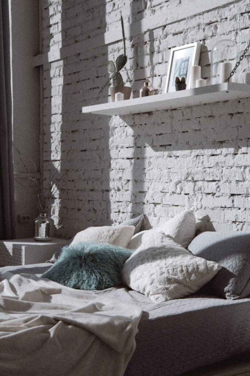 Image off floating shelves above a sleeping area