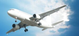 airplane flying in a blue sky