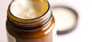 moisturiser in a brown glass pot