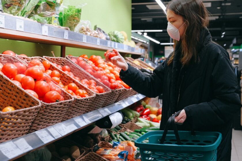 Women in a supermarket wearing a facemask