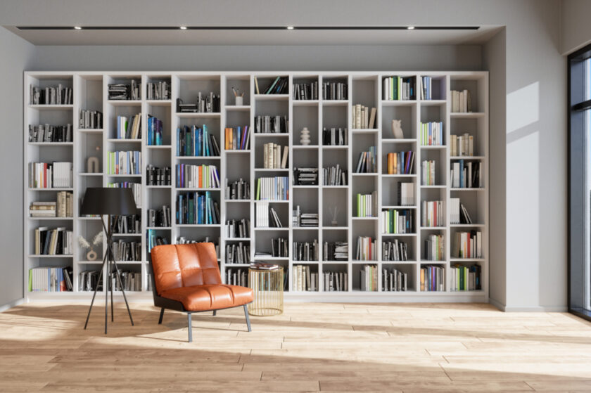 Comfy chair set in a room with large modern bookshelves