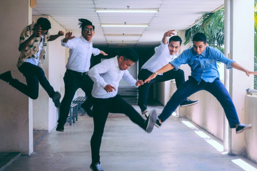 Group of work employees jumping with joy