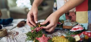 Person handmaking a Christmas wreath