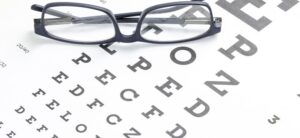 eye chart and a pair of glasses
