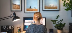 lady sat in front of a computer at home