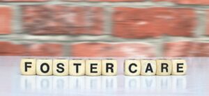 foster care written with wooden blocks