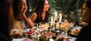 people sitting around at a dinner party