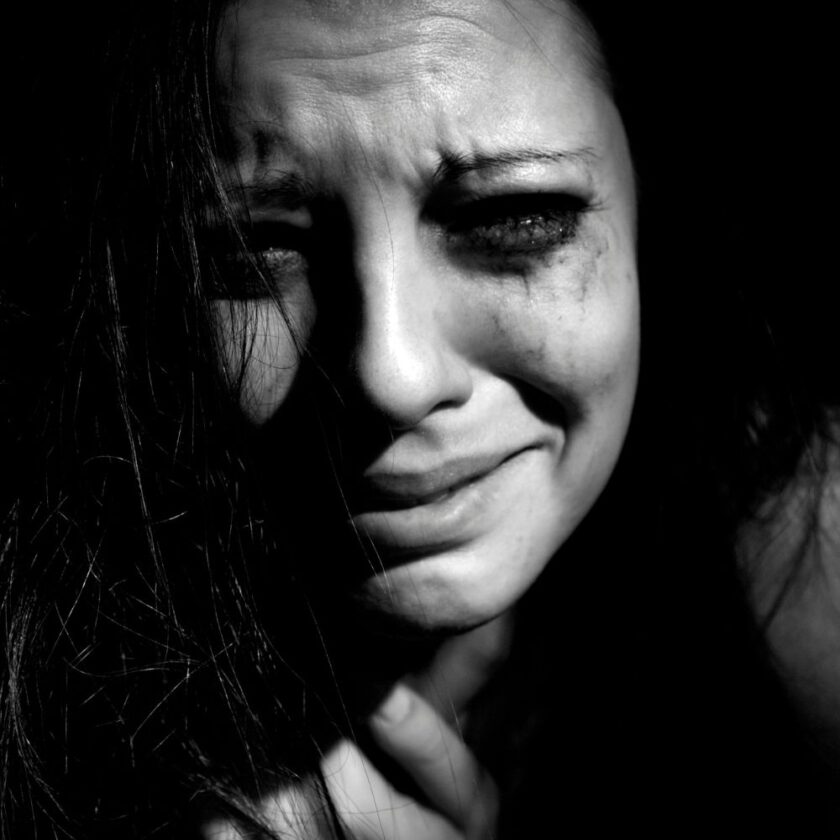 powerful black and white image showing upset woman