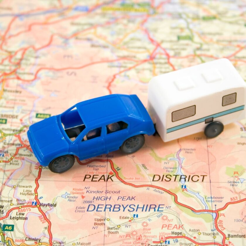 car and caravan toys on a map of England