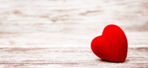 red heart on a wooden backdrop