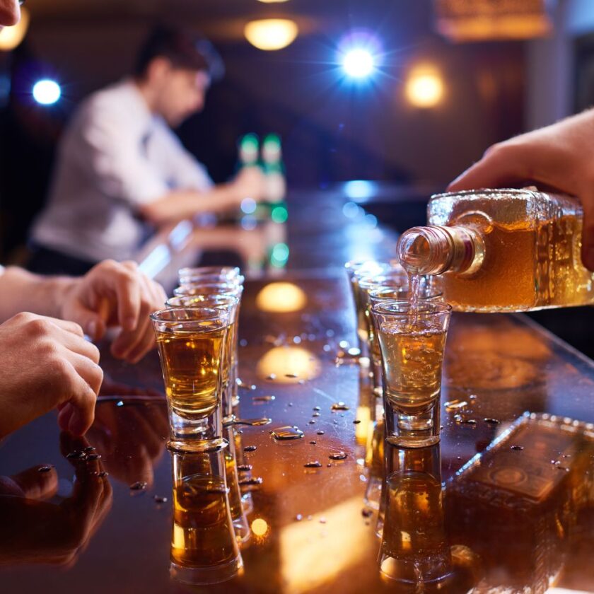alcohol being poured at a bar