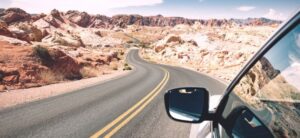 car driving down an open road