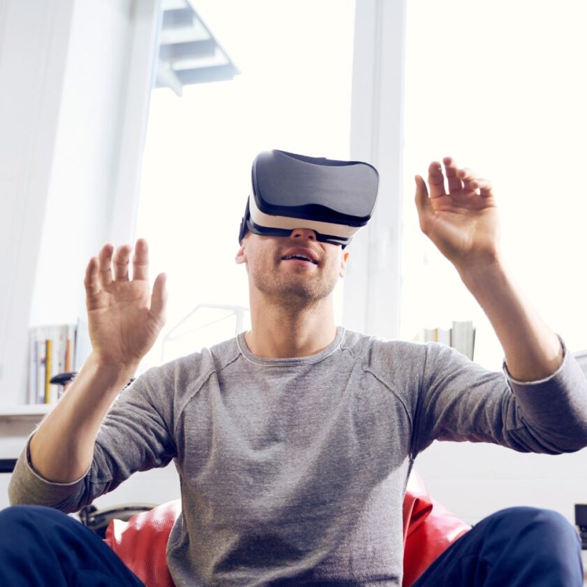 man playing with virtual reality goggles