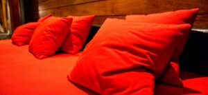 red cushions on a day bed