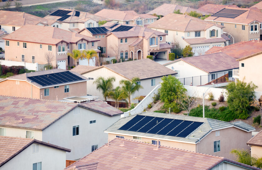 Contemporary Neighborhood Roof Tops View with Solar Panels.