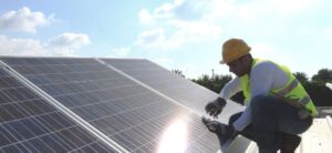 person installing solar panels