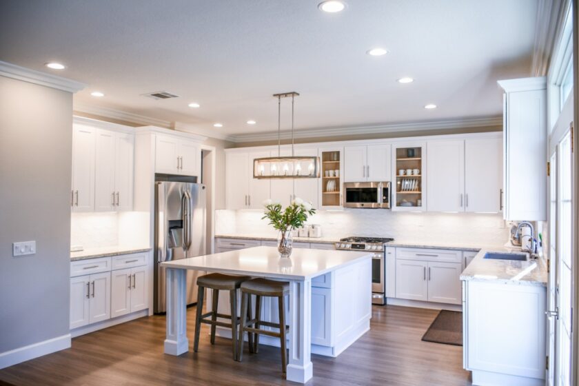 Kitchen with furniture and appliances light and bright in colour and lighting