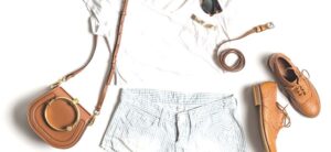 fashion flatlay on a white backdrop