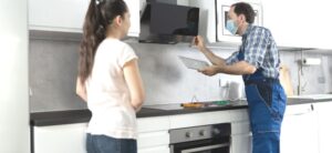 person working on a home appliance