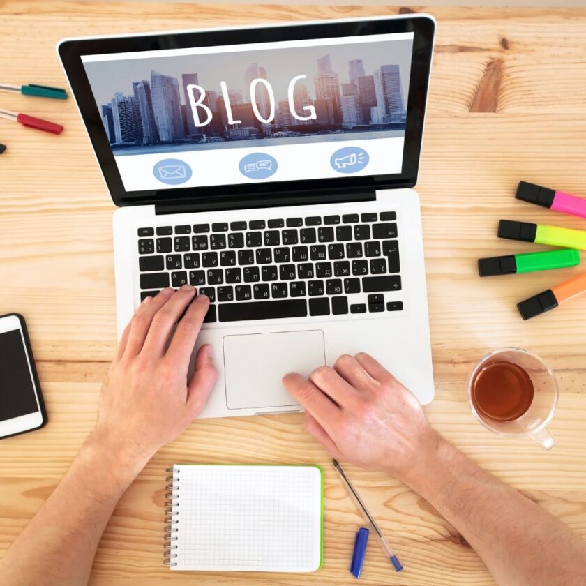 person working on their blog on a laptop