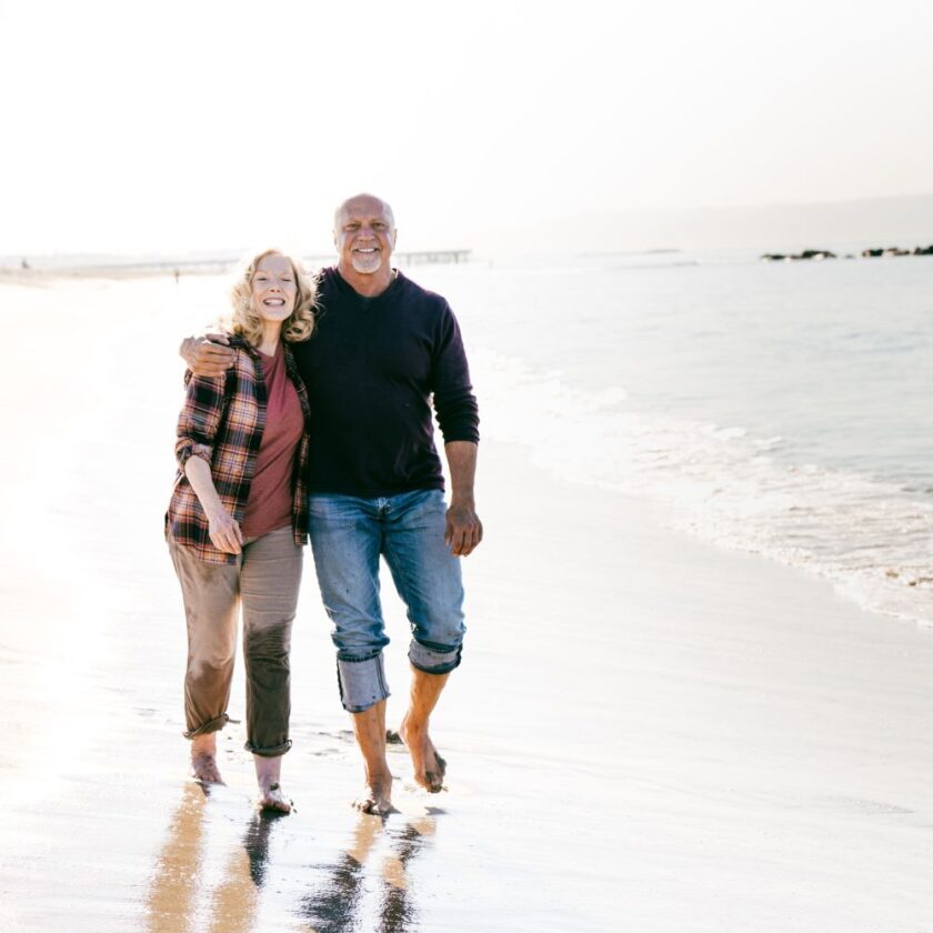 happy retired person on a beach