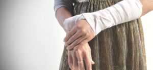 persons arm and thumb bandaged after an injury