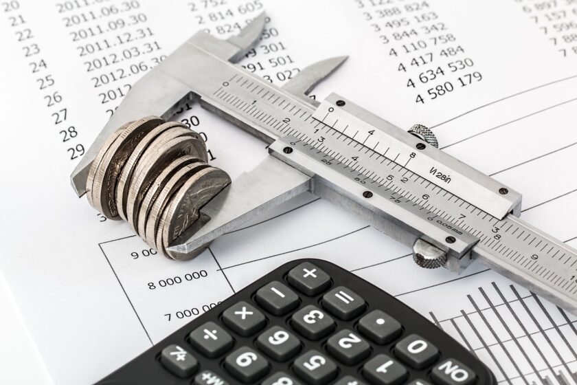 Saving / budgeting image with coins calculater and spreedsheet