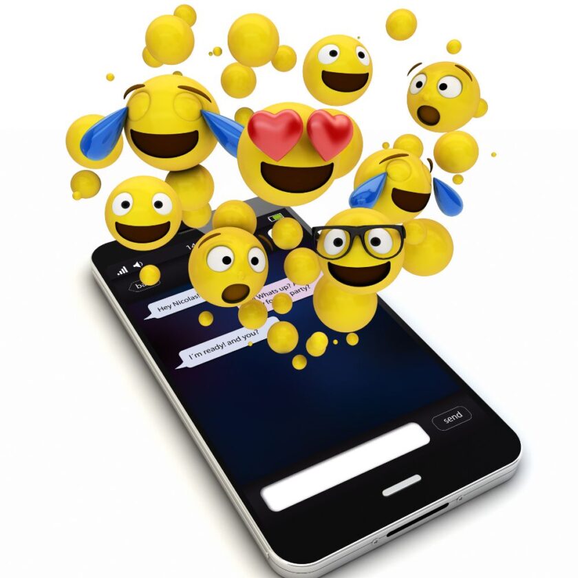 emojis coming out of a phone