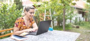 someone working from home in a garden