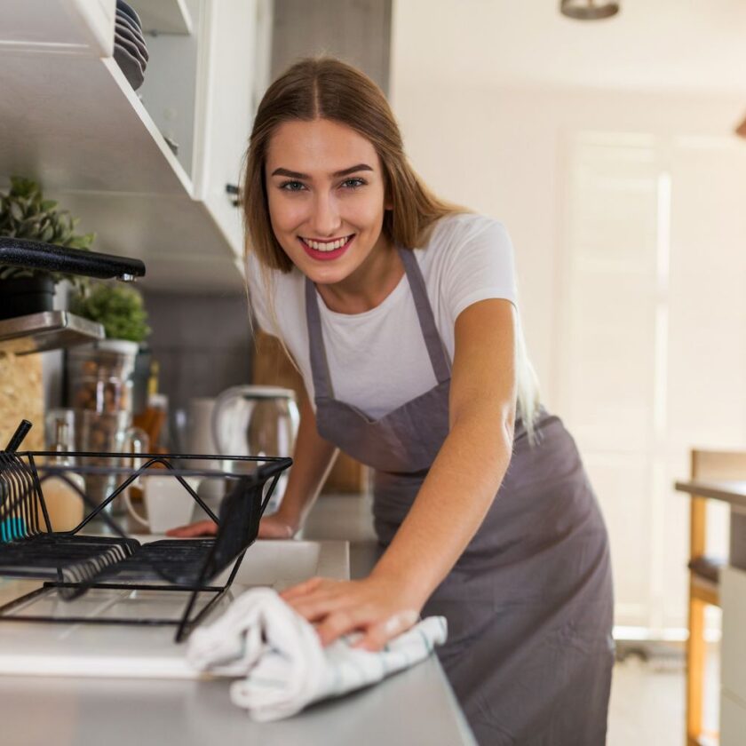 woman cleaning a kitchen counter