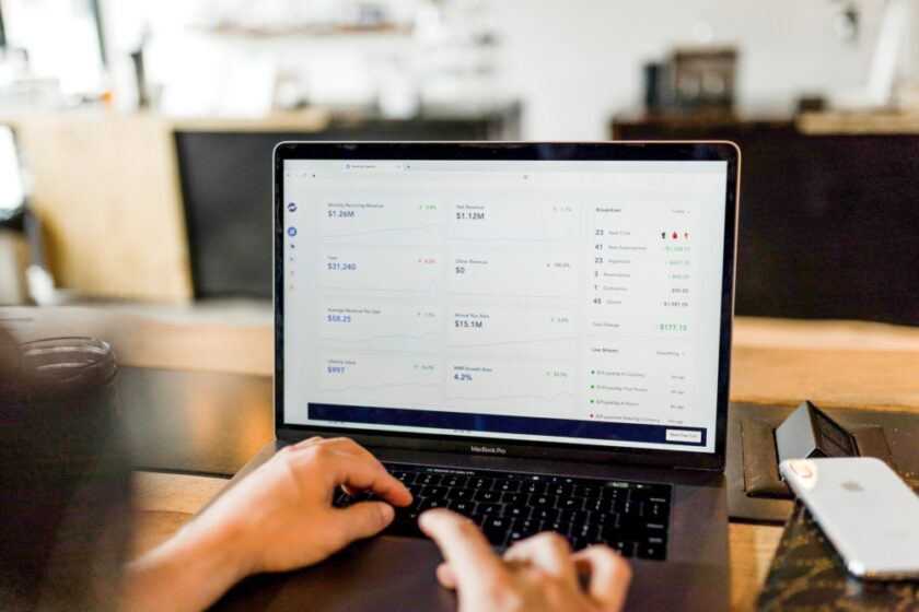 Person using a laptop to look up satistics