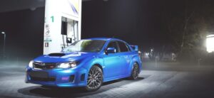 Blue car Subaru Impreza WRX STI stay at fuel station