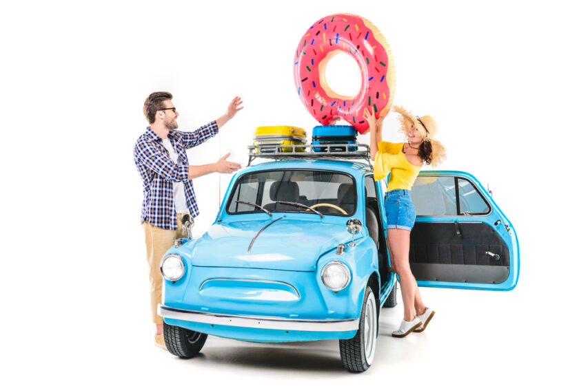 People loading up a car ready for a holiday