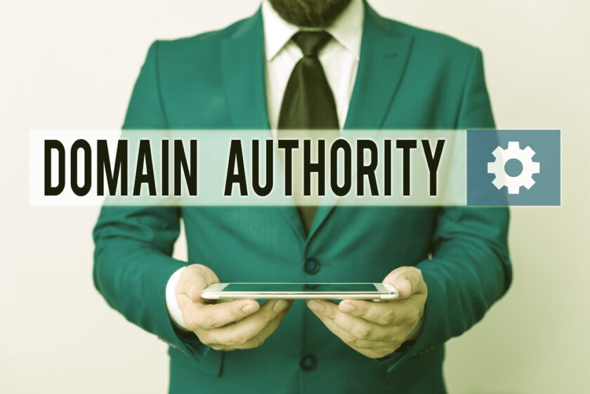 Text sign showing Domain Authority. Business photo text calculated metric for how well a domain is likely to rank Businessman in blue suite with a tie holds lap top in hands
