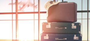 suitcases stacked up at an airpot moving