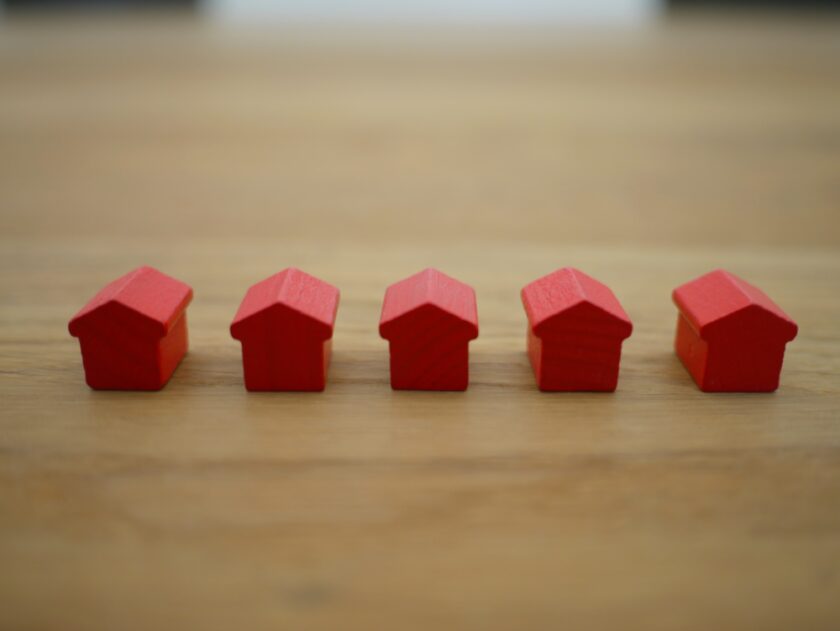 Line of small red monopoly houses