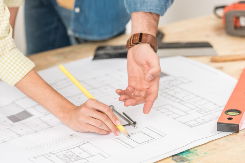 People working on plans for a home