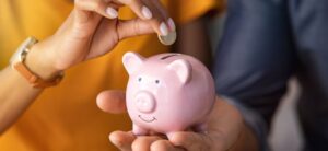 person holding a piggy bank