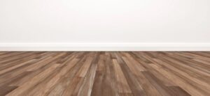 wood type flooring and a white wall
