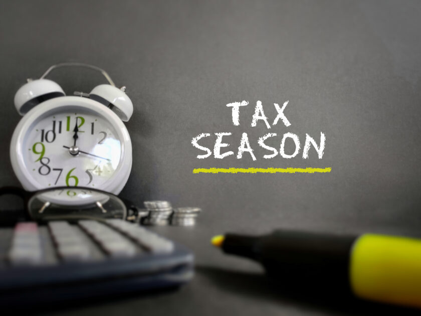 Tax-filling concept - Tax season text in vintage background. Sto