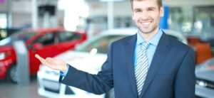 car sales man in a showroom