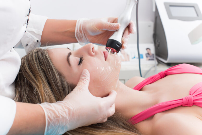 Woman doing cosmetic procedures in spa clinic