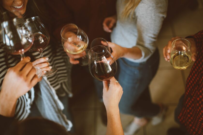 Group of people with wine glasses in hand