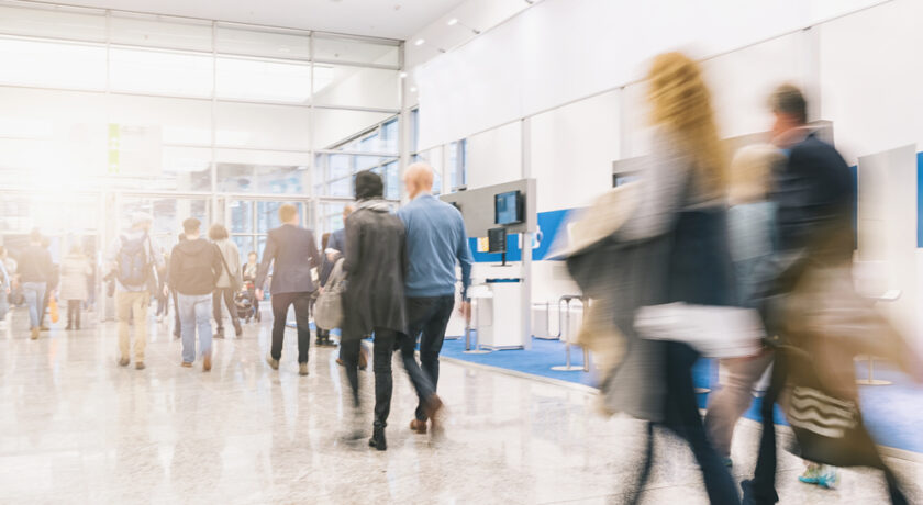 crowd of people rushing on a trade show booth. ideal for websites and magazines layouts