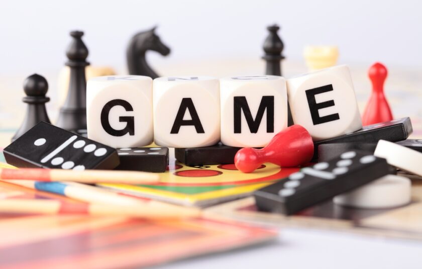 Detail of board games, pawns, chessmen, dominoes, mikado sticks.